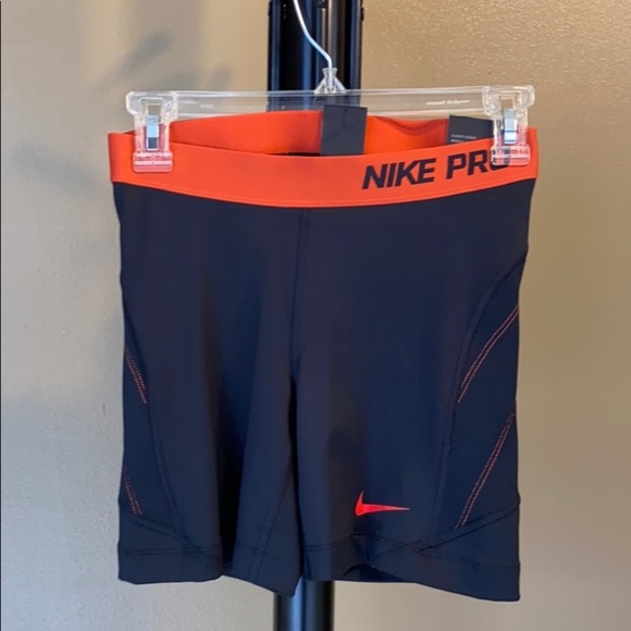 Nike Pants - Nike dri fit orange and black small shorts